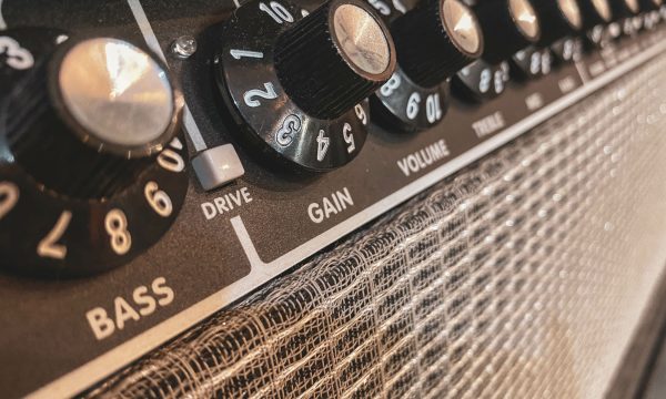 Close up of the black gain knob a vintage electric guitar clean Close up of the black gain knob a vintage electric guitar clean