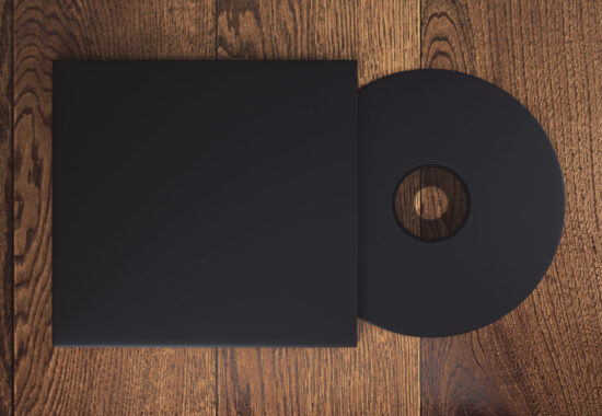 Black CD Topview of blank black compact disk with cover on wooden table. Mock up, 3D Rendering